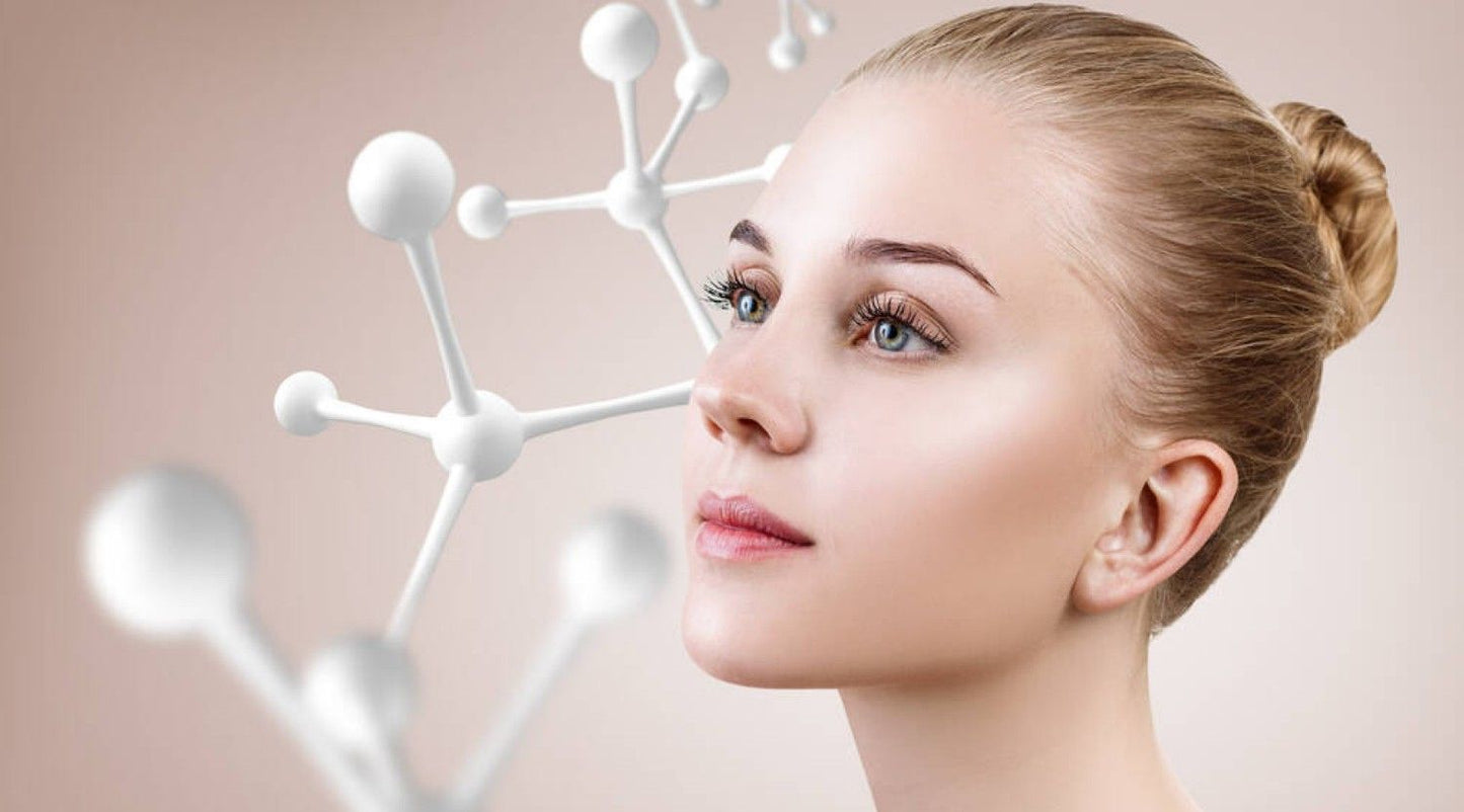 Woman beside molecular model representing the science of nanotechnology.