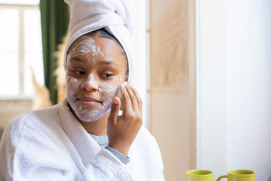 A woman using a CBD skincare product